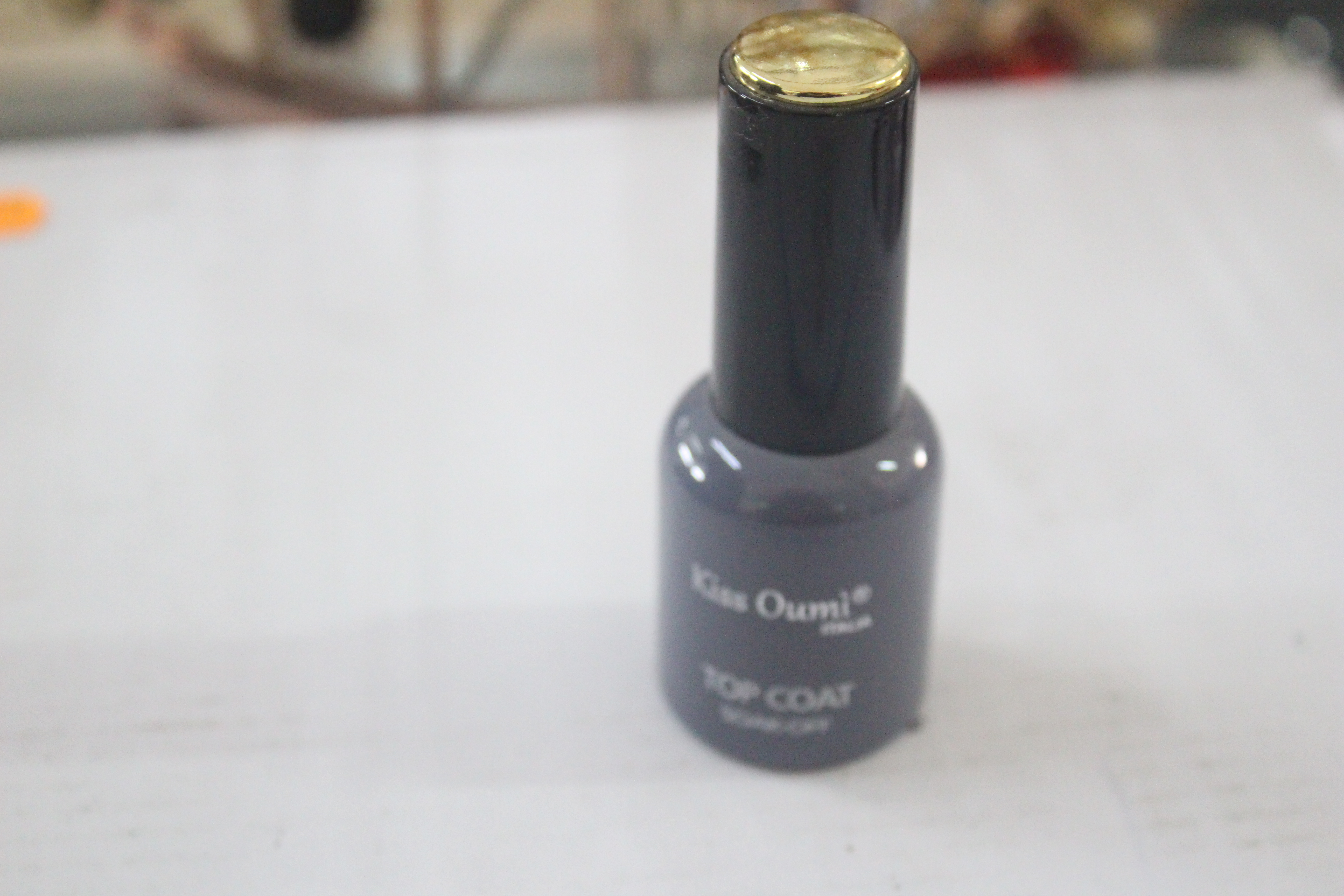 Nail varnish ; Kiss Oumi ® Italia ; Top Coat So...